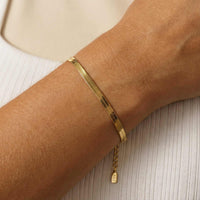 Thumbnail for Kauai Herringbone Bracelet by Brother & Sisters features sleek herringbone design in liquid-gold shimmer.