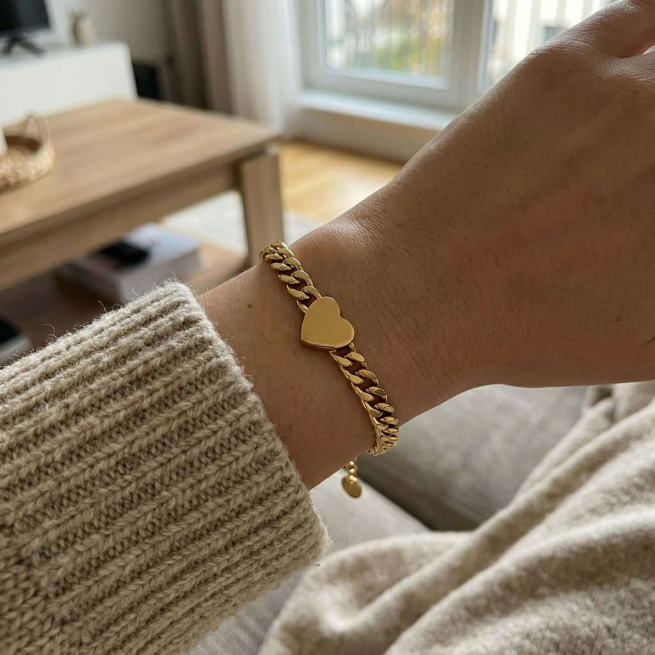 Love Couple Bracelet with a polished heart on a Cuban link chain by Brother & Sisters, highlighting connection and love.