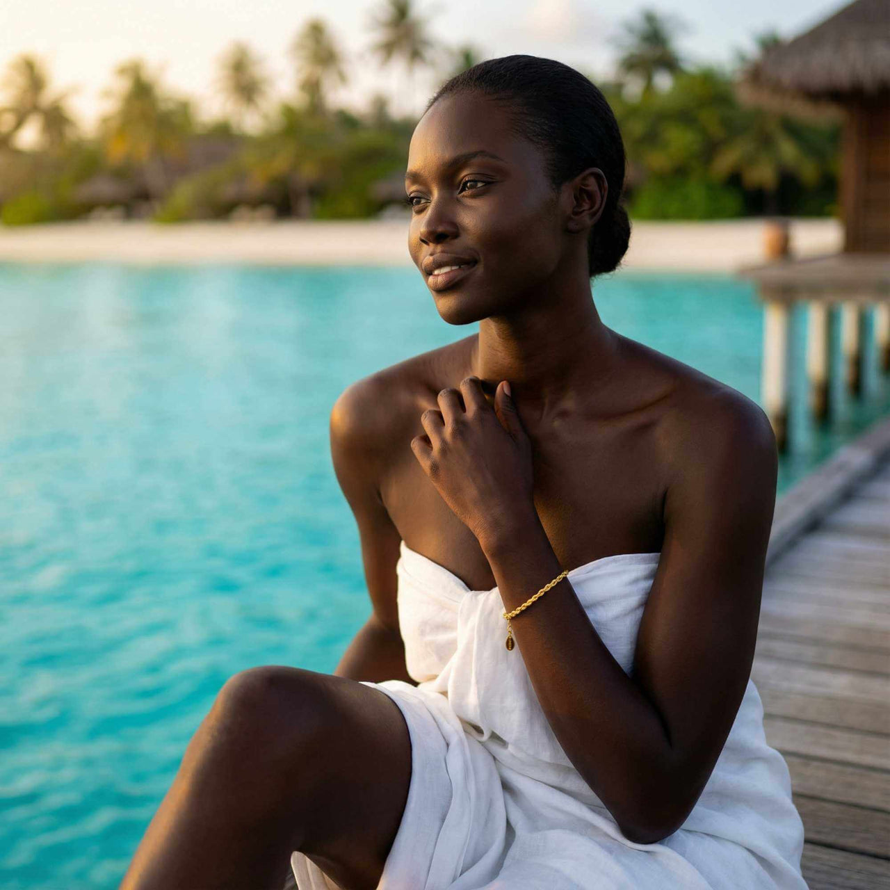 Model wearing Calvi Rope Chain Bracelet by Brother & Sisters by the beach, showcasing its elegant design.