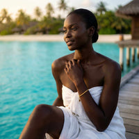 Thumbnail for Model wearing Calvi Rope Chain Bracelet by Brother & Sisters by the beach, showcasing its elegant design.
