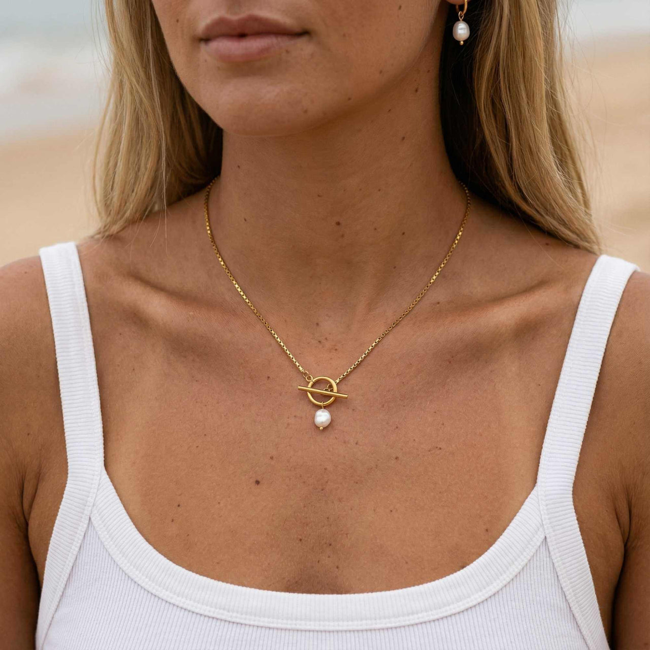 La Isla Pearl Toggle Necklace featuring a sculptural gold toggle and freshwater pearl by Brother & Sisters.