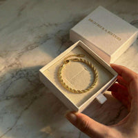 Thumbnail for Calvi Rope Chain Bracelet in a gift box by Brother & Sisters, featuring twisted links and premium gold finish.