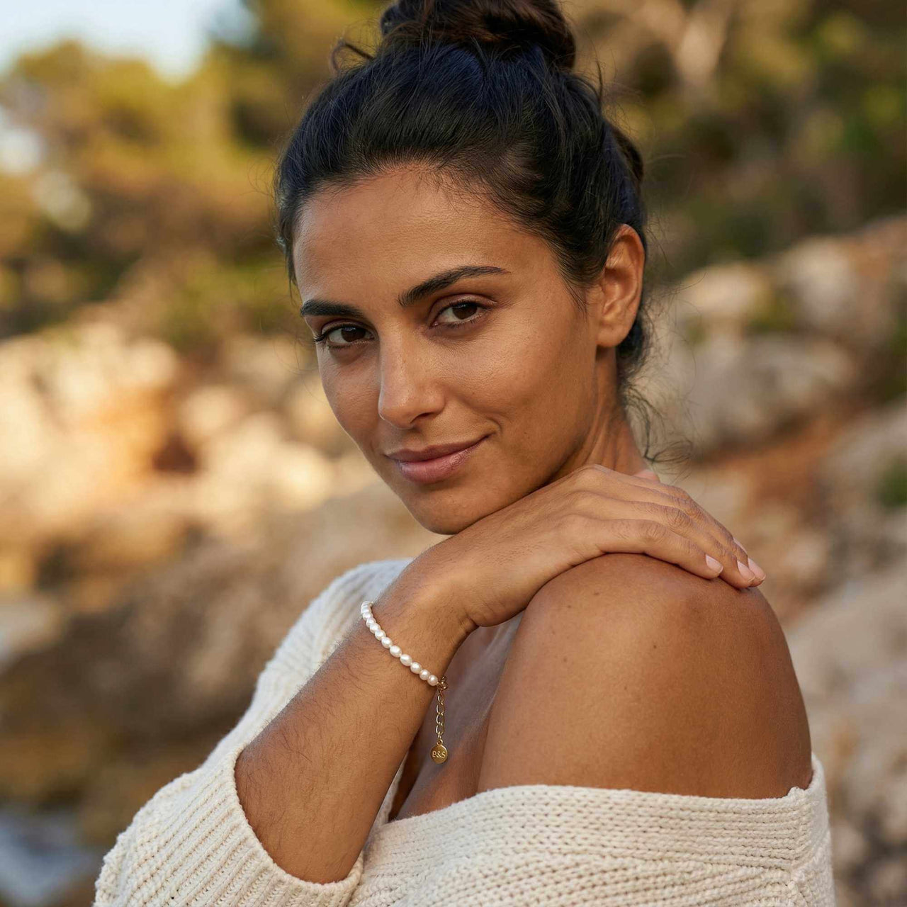Freshwater Pearl Bracelet worn by a woman outdoors, showcasing its elegance and unique pearls, by Brother & Sisters.