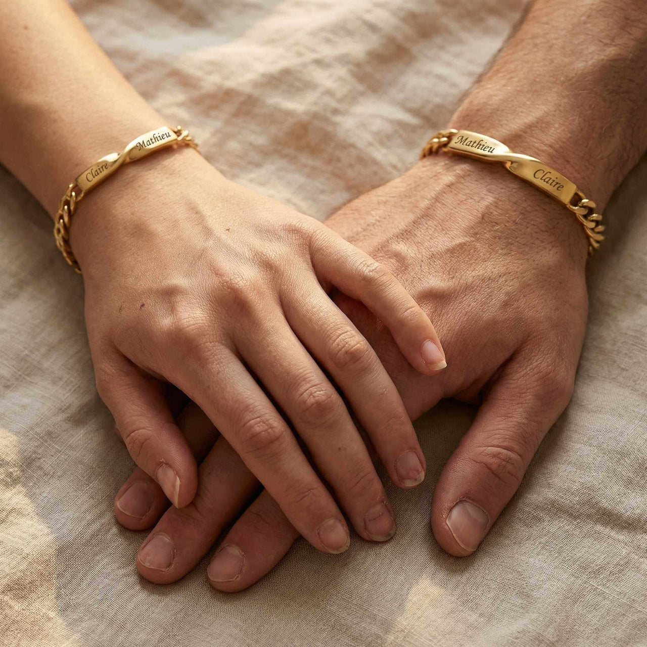 Infinity Bond Matching Bracelet worn by two people, showcasing twisted bar design with names, by Brother & Sisters.