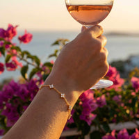 Thumbnail for Crystal Flower Bracelet by Brother & Sisters, featuring sparkling four-leaf crystal flowers on a delicate chain.