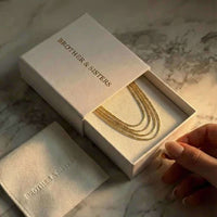 Thumbnail for Riviera Layered Choker in a gift box by Brother & Sisters, featuring four delicate chains for effortless layered style.