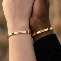 Thumbnail for Matching Couple Bracelet showing gold cuffs engraved with 'Soul' and 'Sister', designed by Brother & Sisters.