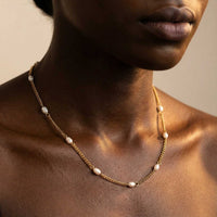 Thumbnail for Dainty Pearl Choker on a model, featuring tiny freshwater pearls on a delicate gold chain by Brother & Sisters.