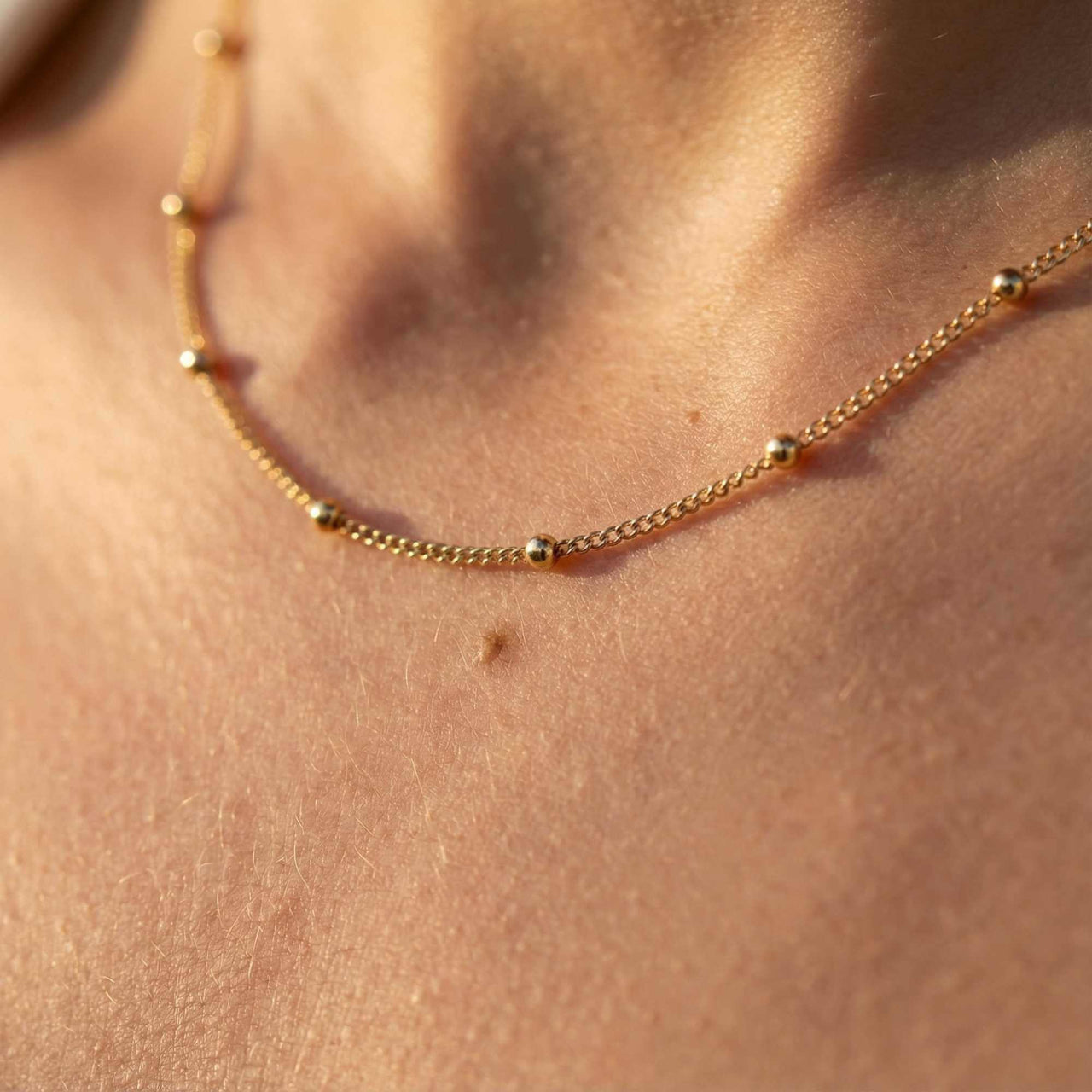 Julia Beaded Chain Necklace featuring a delicate gold chain with tiny beads by Brother & Sisters.