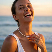 Thumbnail for Joyful bride wearing pearl choker at golden hour beach — bridal pearl necklace for wedding day