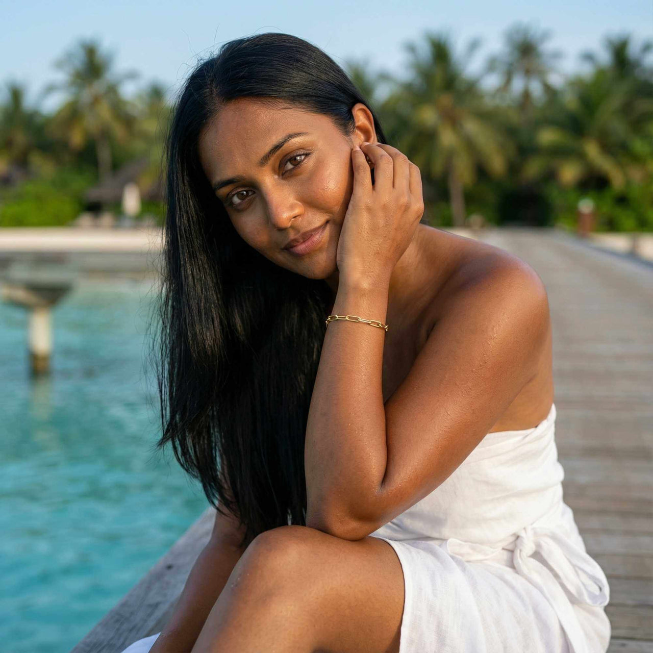 Young woman wearing a Paperclip Chain Bracelet, showcasing its elegant design by Brother & Sisters.