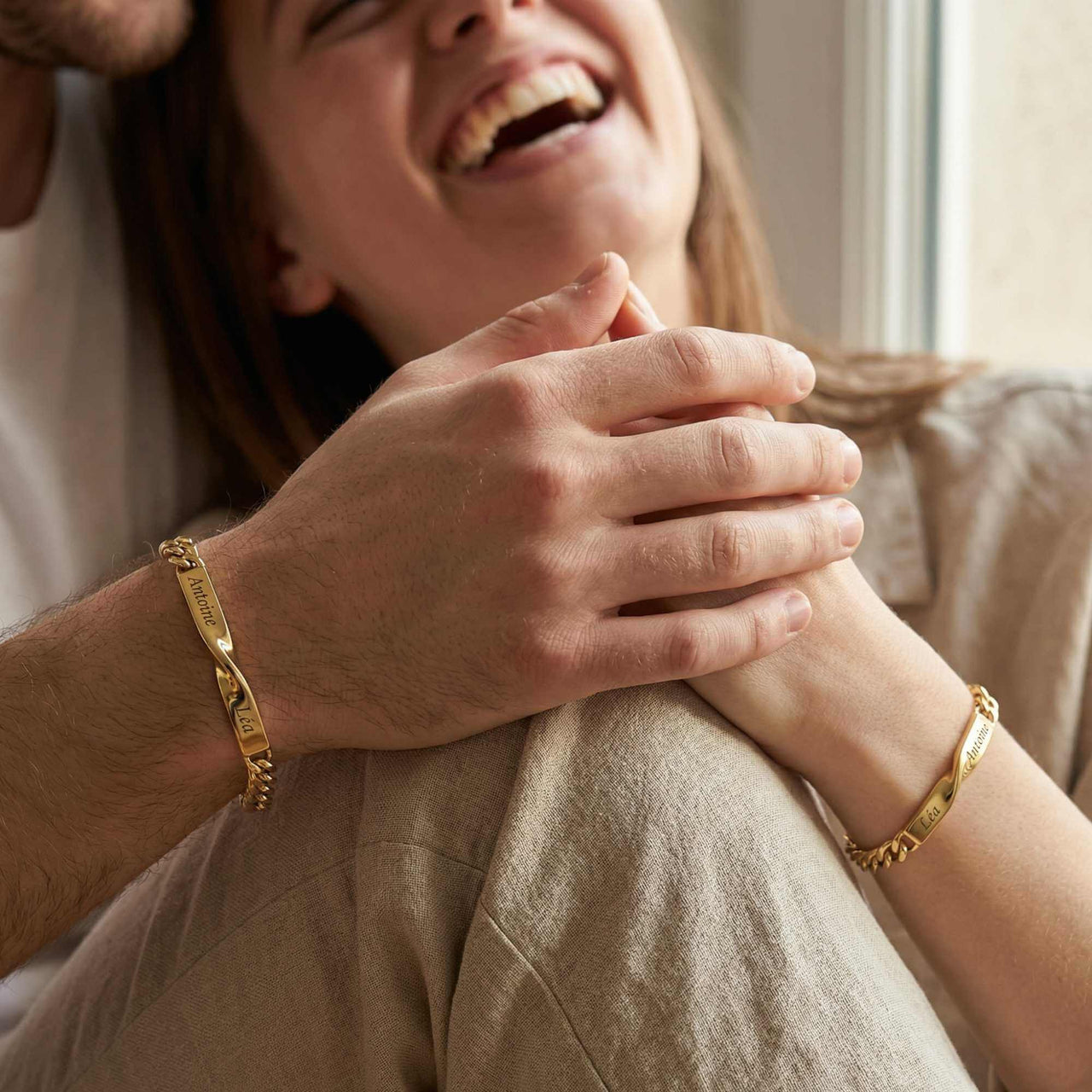 Couple wearing Infinity Bond Matching Bracelets by Brother & Sisters, symbolizing unbreakable connection.