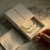 Thumbnail for Infinity Bond Matching Bracelet in elegant packaging by Brother & Sisters, showcasing the twisted name feature.