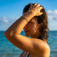 Thumbnail for Woman wearing Paperclip Chain Bracelet by Brother & Sisters on a sunny beach, showcasing its minimalist style.