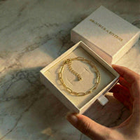 Thumbnail for Paperclip Chain Bracelet from Brother & Sisters in a gift box, featuring premium gold stainless steel links.