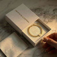 Thumbnail for Love Couple Bracelet in a gift box by Brother & Sisters, featuring a polished heart and bold Cuban link chain.