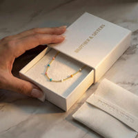 Thumbnail for Rainbow Choker by Brother & Sisters in a gift box, showcasing colorful enamel beads and elegant packaging.
