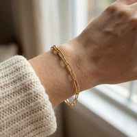Thumbnail for Paperclip Chain Bracelet on wrist, showcasing elegant links in 18K gold by Brother & Sisters.