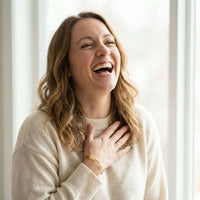 Thumbnail for Laughing woman wearing a Matching Couple Bracelet by Brother & Sisters, showcasing personalized engravings.