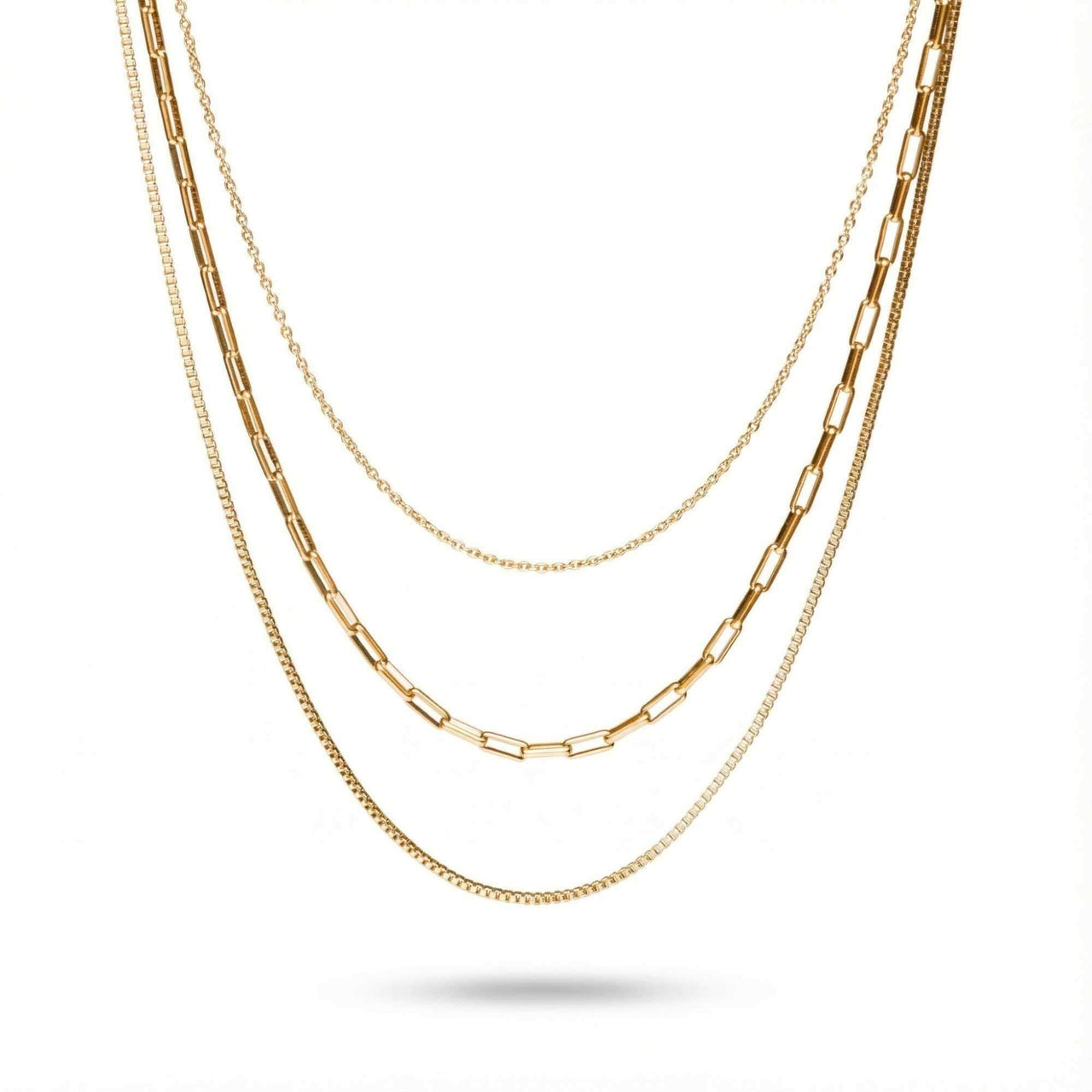 Saona Triple Layer Necklace by Brother & Sisters featuring three gold chains at different lengths.