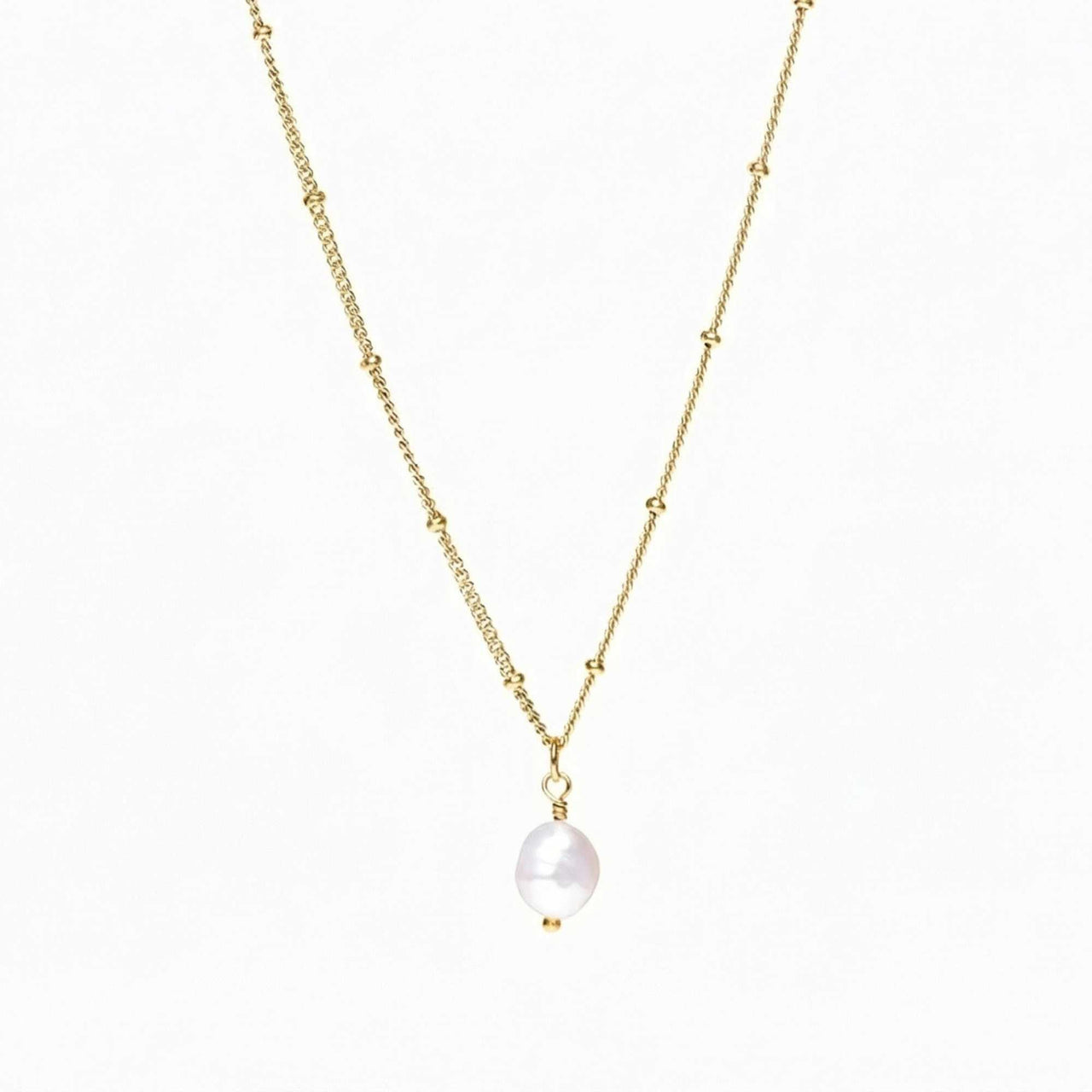 Elegant Pearl Drop Necklace by Brother & Sisters featuring a baroque pearl on a textured satellite chain.