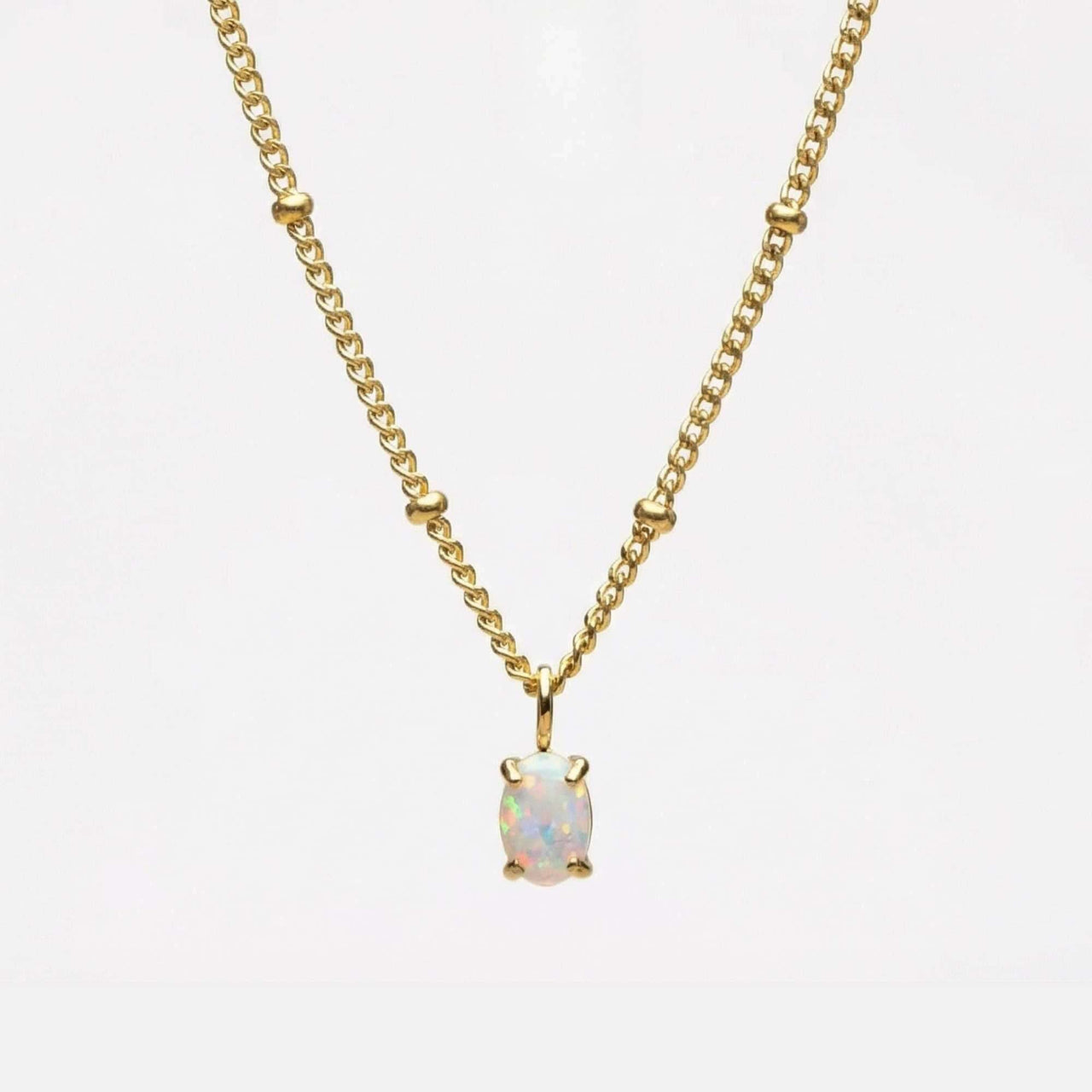 Opal Pendant Necklace by Brother & Sisters featuring AAA-grade opal in gold prongs on a delicate bead chain.