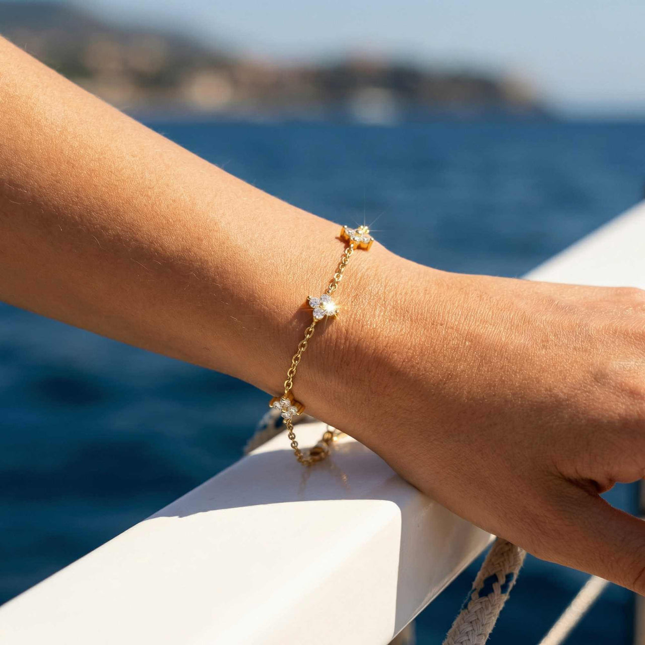 Crystal Flower Bracelet showcasing five crystal flowers on a delicate chain by Brother & Sisters, capturing elegance and sparkle.