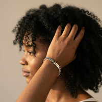 Thumbnail for Infinity Bond Matching Bracelet worn by a woman, showcasing its twisted bar design by Brother & Sisters.