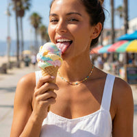 Thumbnail for Model wearing Rainbow Choker with colorful candy beads, enjoying ice cream on a sunny beach day.