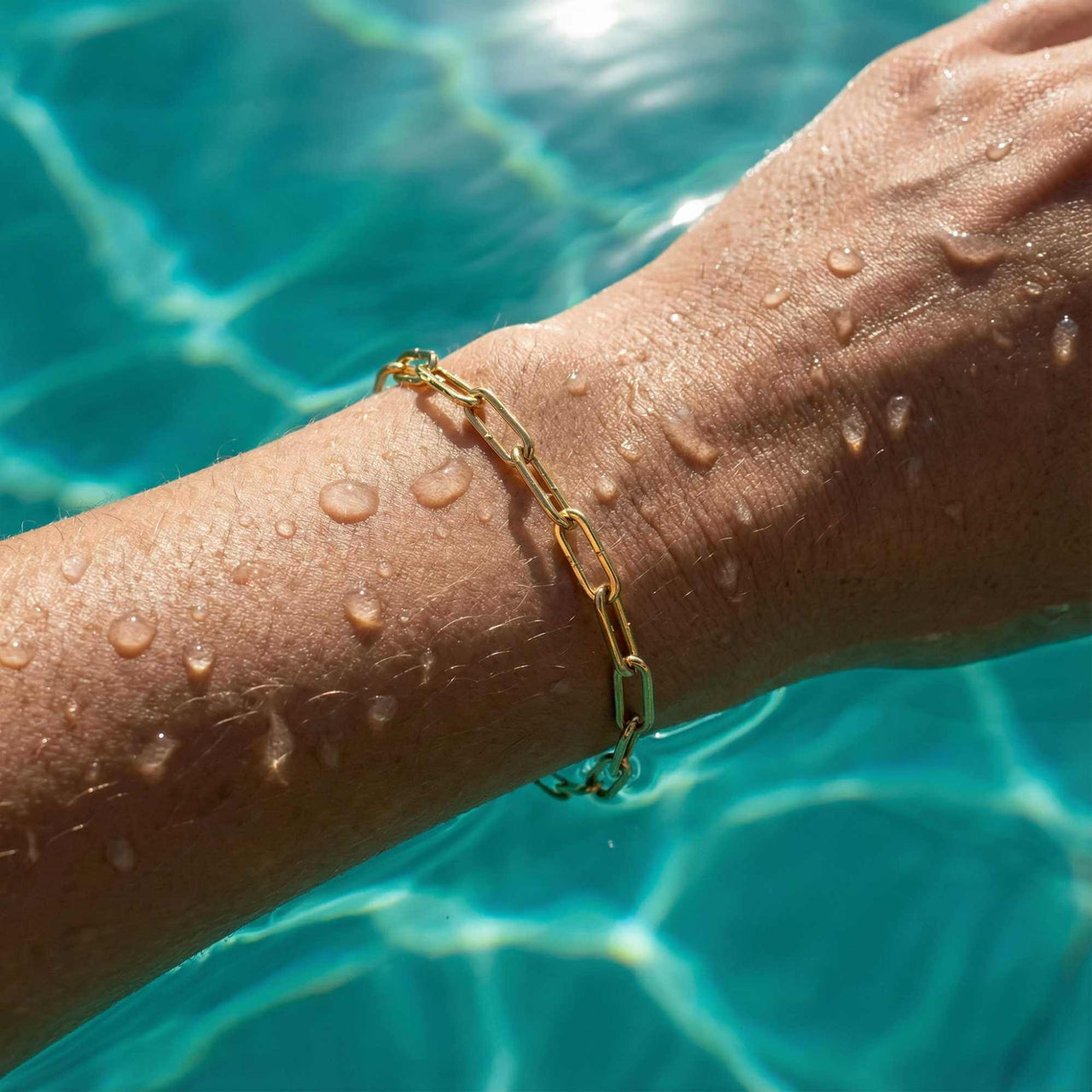 Freshwater Pearl Bracelet by Brother & Sisters worn on a wrist with droplets of water.