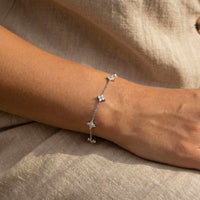 Thumbnail for Crystal Flower Bracelet by Brother & Sisters features five delicate crystal flowers on a fine chain.