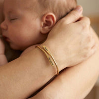 Thumbnail for Wrap Couple Bracelet featuring custom engraving of names on a delicate bypass cuff by Brother & Sisters.
