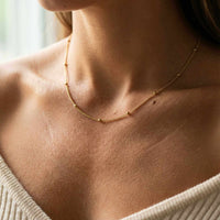 Thumbnail for Julia Beaded Chain Necklace by Brother & Sisters, featuring a delicate chain with tiny golden beads for effortless elegance.