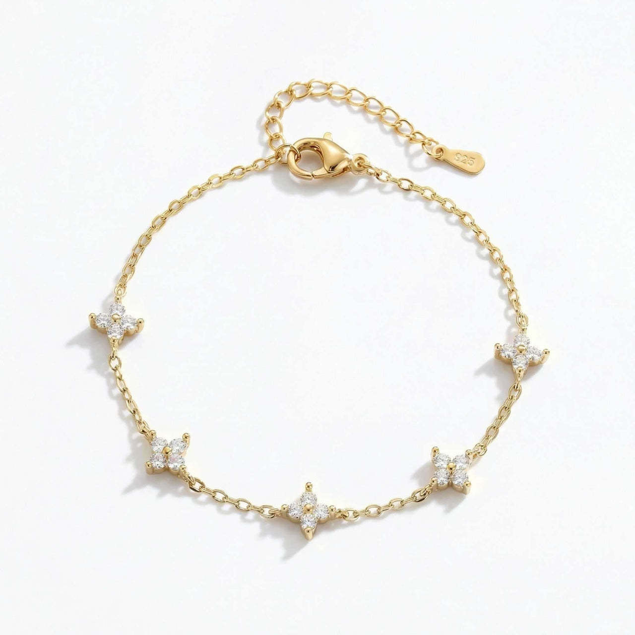 Crystal Flower Bracelet by Brother & Sisters featuring five sparkling crystal flowers on a delicate gold chain.