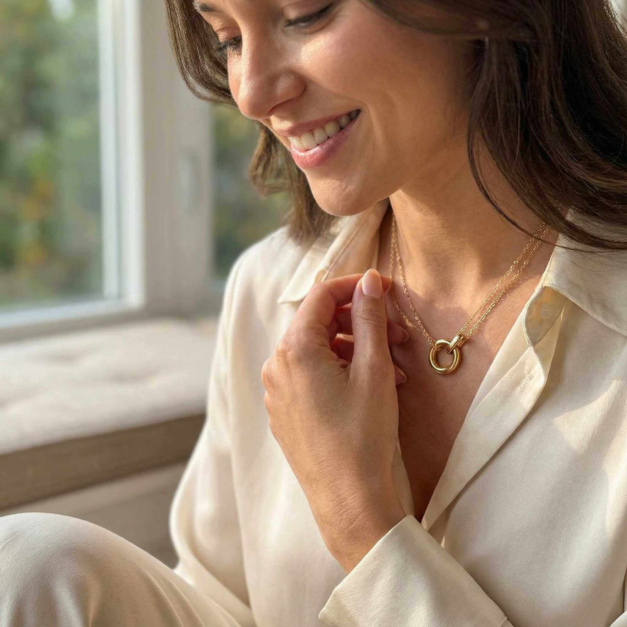 The Eternal Link necklace by Brother & Sisters, featuring an elegant double-layer design with an interlocking circle pendant.