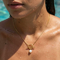 Thumbnail for La Isla Pearl Toggle Necklace featuring a sculptural gold T-bar clasp and freshwater pearl by Brother & Sisters.