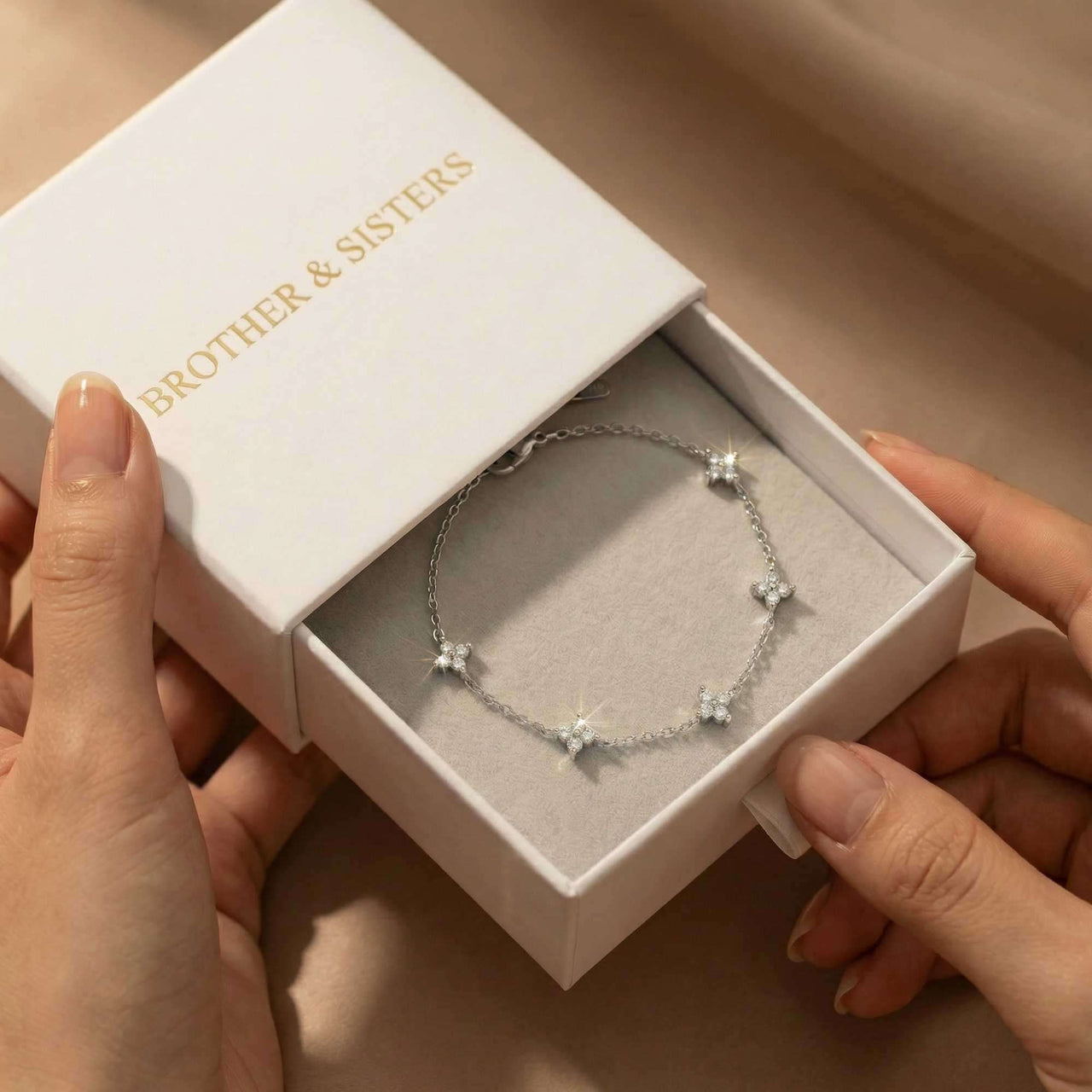 Crystal Flower Bracelet by Brother & Sisters in a gift box, showcasing five sparkling crystal flowers on a delicate chain.