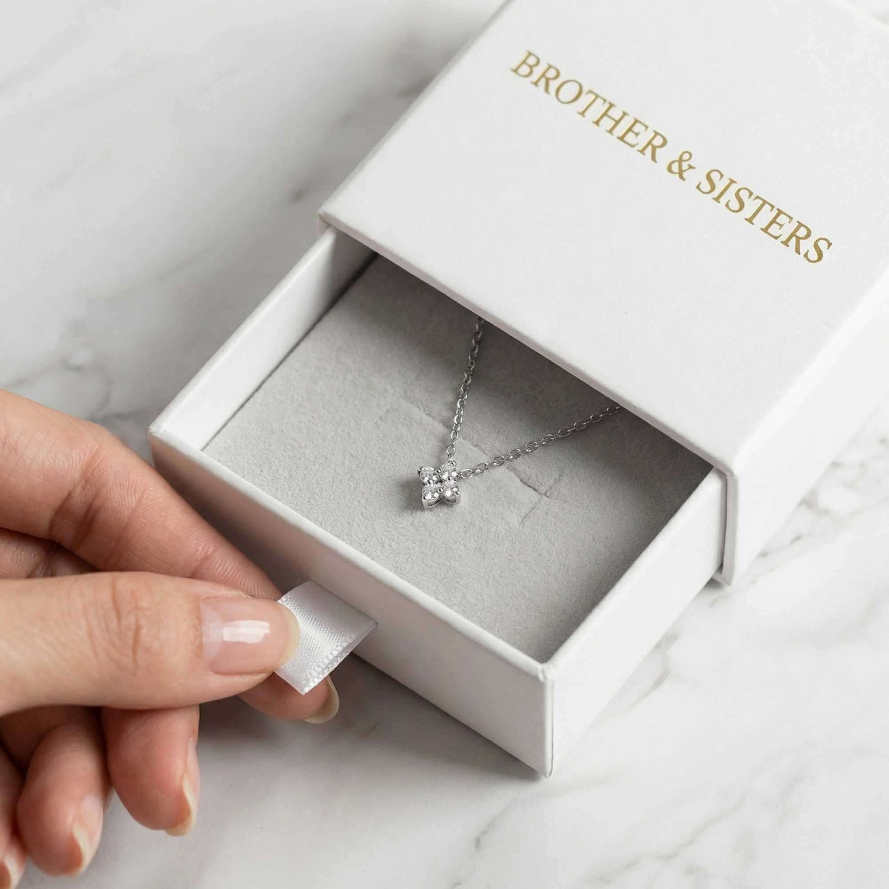Crystal Flower necklace in B&S gift box — dainty refined four-leaf crystal flower pendant luxury packaging
