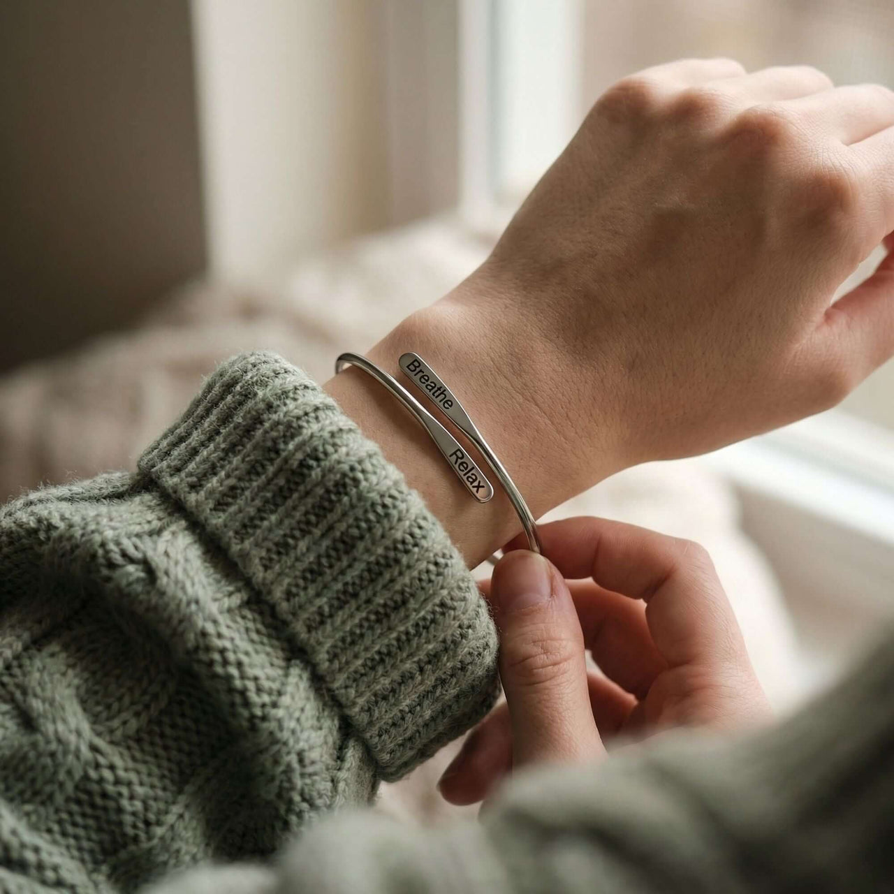 Close-up of a Wrap Couple Bracelet featuring custom engravings, showcasing the delicate design by Brother & Sisters.