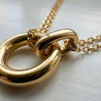 Thumbnail for The Eternal Link necklace by Brother & Sisters features a double-layer design with interlocking gold circle pendants.