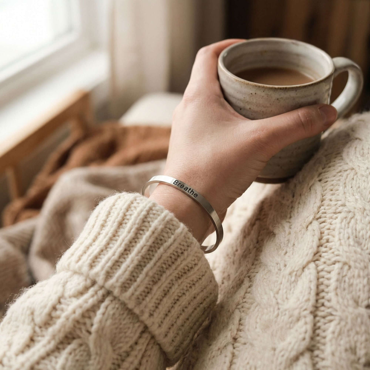 Matching Couple Bracelet featured on a cozy sweater-clad wrist, holding a coffee cup, by Brother & Sisters.