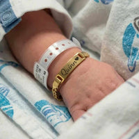 Thumbnail for Infant Bracelet featuring a golden personalized name plate with the name Quinn, by Brother & Sisters.