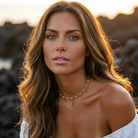 Thumbnail for White Beaded Choker by Brother & Sisters worn by a model with long wavy hair, showcasing its delicate design.