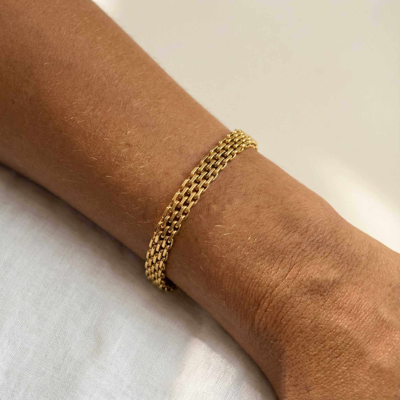 Sifnos Woven Bracelet showcasing intricate gold mesh design on wrist by Brother & Sisters.