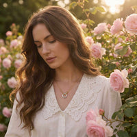 Thumbnail for The Unity Bond necklace by Brother & Sisters featuring polished silver and gold, worn by a model in a rose garden.