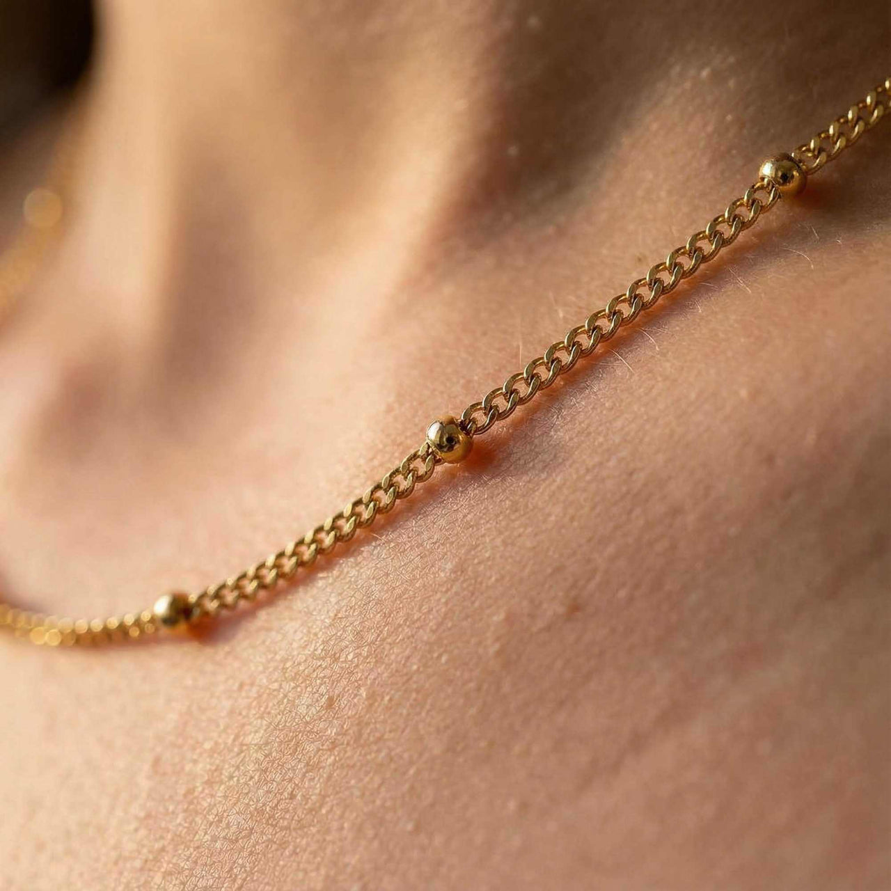 Julia Beaded Chain Necklace featuring a delicate chain with tiny golden beads by Brother & Sisters.