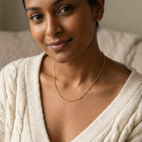 Thumbnail for Julia Beaded Chain Necklace worn by a woman, featuring tiny golden beads by Brother & Sisters.
