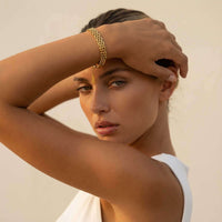 Thumbnail for Sifnos Woven Bracelet worn by model, showcasing intricate interlocking links and 18K gold PVD finish by Brother & Sisters.