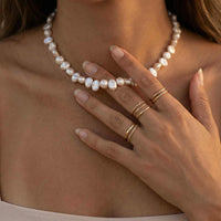 Thumbnail for Sunseeker Pearl Choker showcasing irregular baroque pearls on a golden chain by Brother & Sisters.
