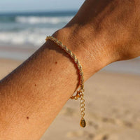 Thumbnail for Calvi Rope Chain Bracelet on a wrist, showcasing twisted links and 18K gold PVD finish by Brother & Sisters.